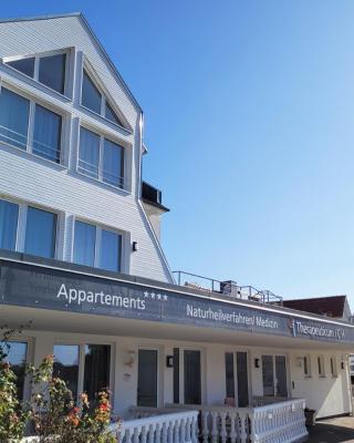 Gemütliche Ferienwohnung mit Meerblick und Terrasse - Nur 50 Meter zum Strand inklusive Parkplatz und Fahrradunterstellplatz