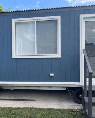 Sweet Cute blue tiny home with Pool and 2 minute drive to the beach