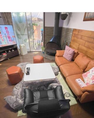 Tatami room & Living Room equipped with Multinational TV and Fire, BBQ corner in Tokyo Downtown House