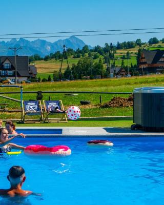 Aparthotel Rabiań-SKI zewnętrzny basen oraz jacuzzi z podgrzewana wodą dmuchaniec i 2 place zabaw w cenie