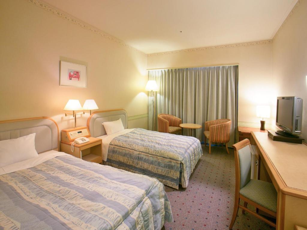 山形七日町华盛顿酒店客房内的一张或多张床位