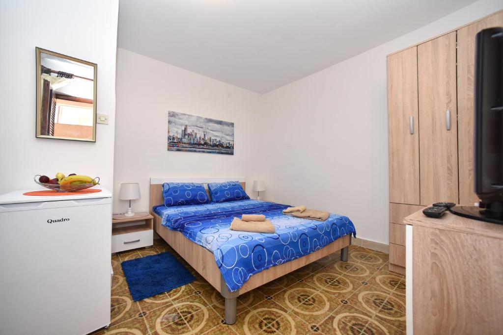 MG apartments and rooms客房内的一张或多张床位