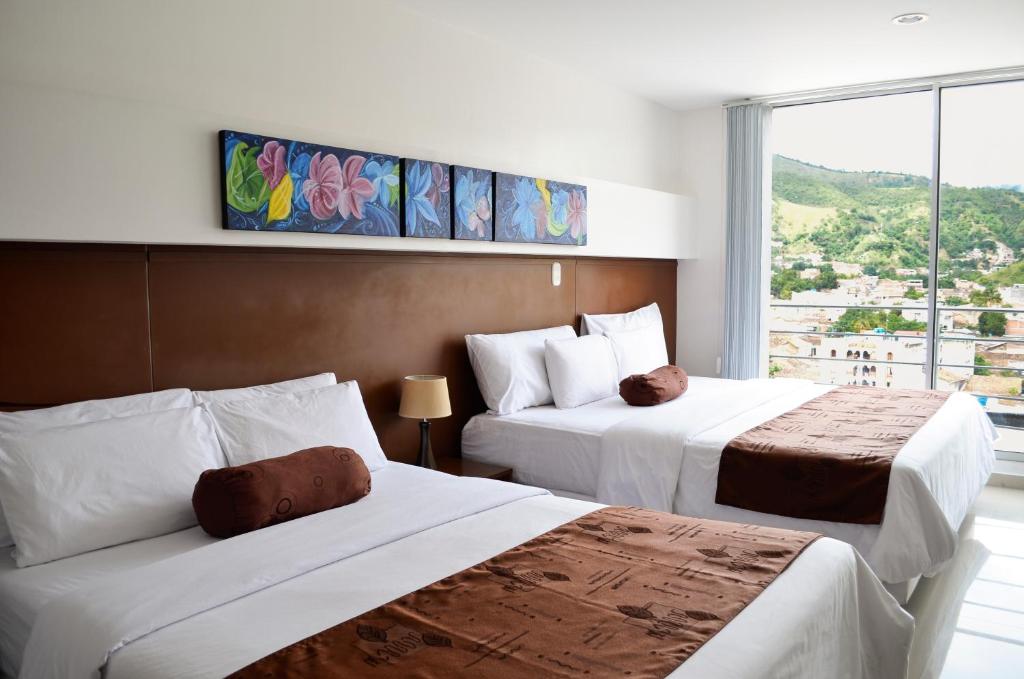 Hotel Tarigua Ocaña客房内的一张或多张床位