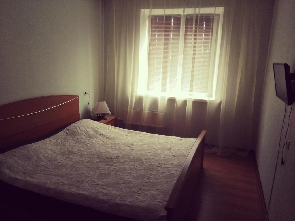 Apartment NG Na Chertygasheva客房内的一张或多张床位