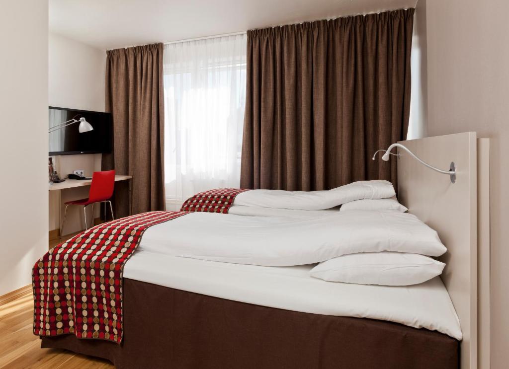 MediInn Hotel Oslo客房内的一张或多张床位