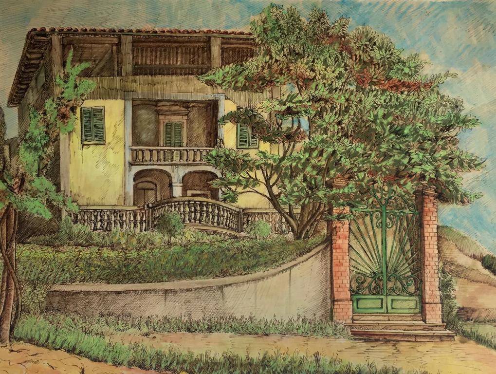 蒙特瓦尔基Villa Baronzola的画有栅栏和树木的房子