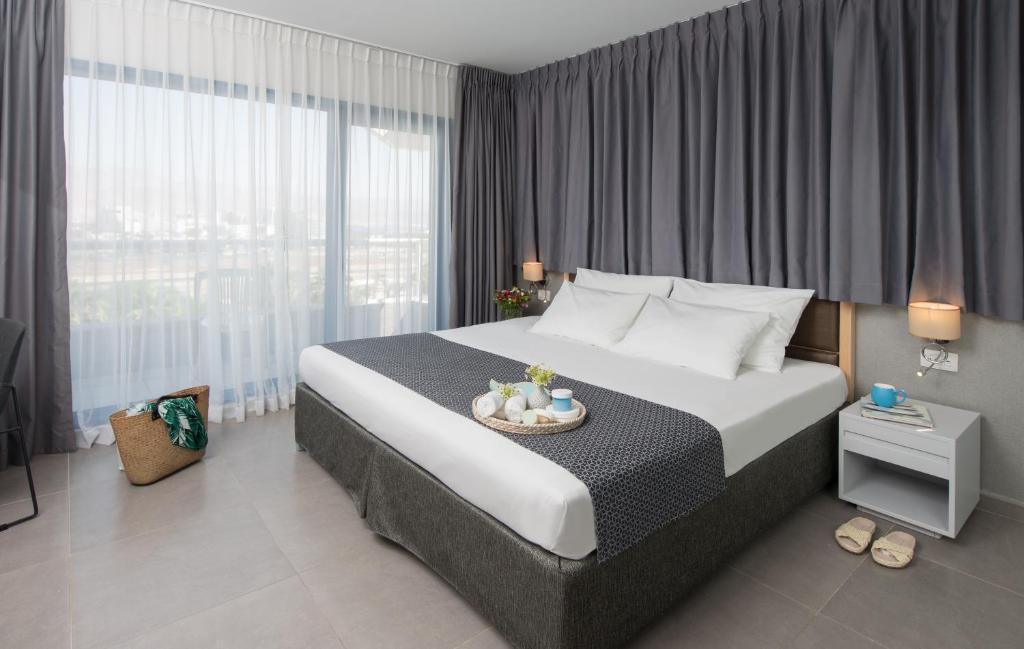 Hotel Astral Nirvana Club- Half Board客房内的一张或多张床位