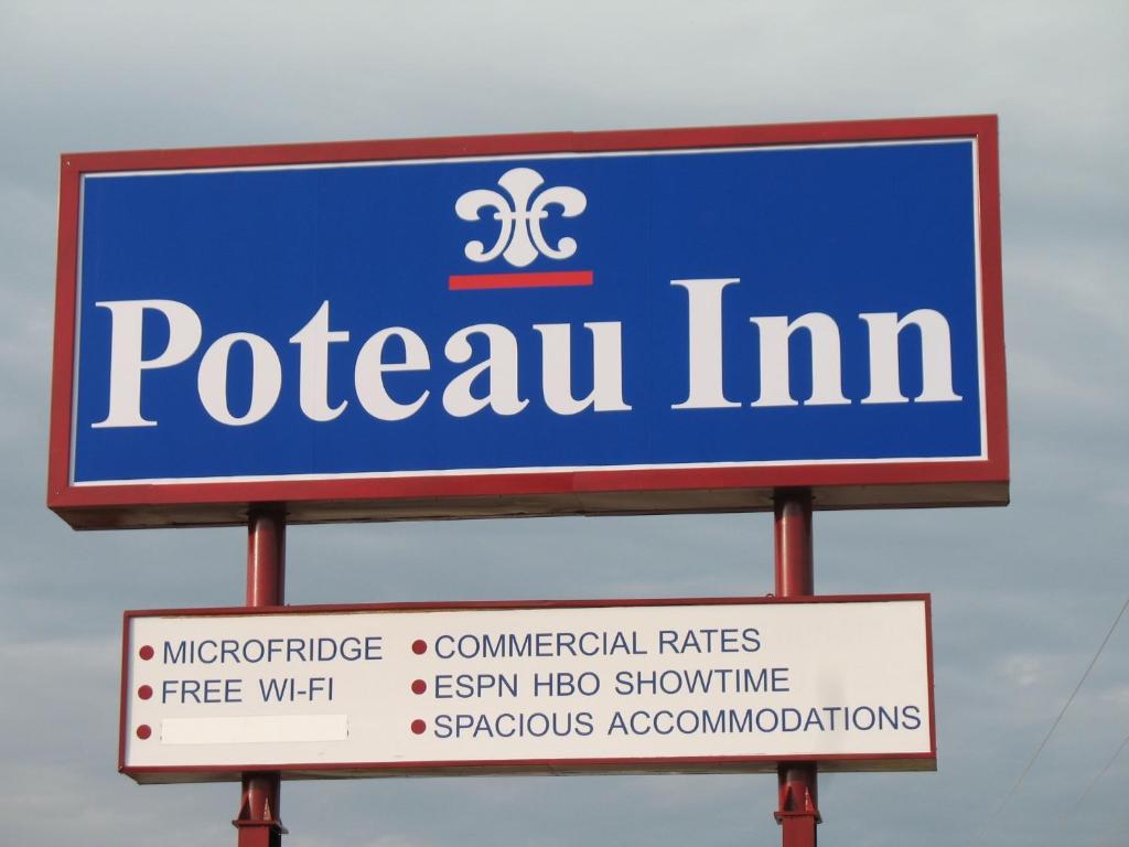 PoteauPoteau Inn的两个标志上的一个 ⁇ 的标志