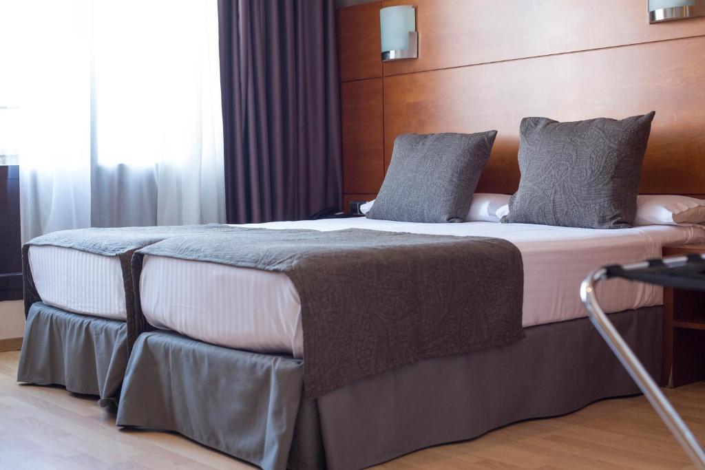维亚奥古斯塔酒店客房内的一张或多张床位