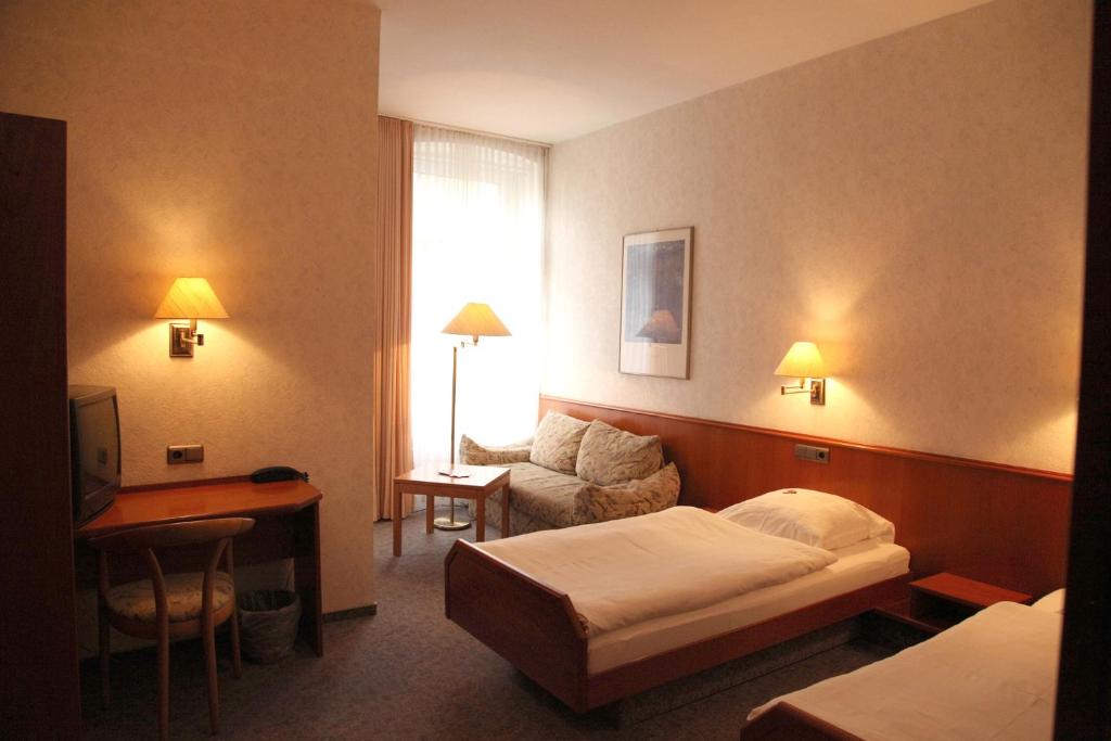 Ackfeld Hotel-Restaurant客房内的一张或多张床位