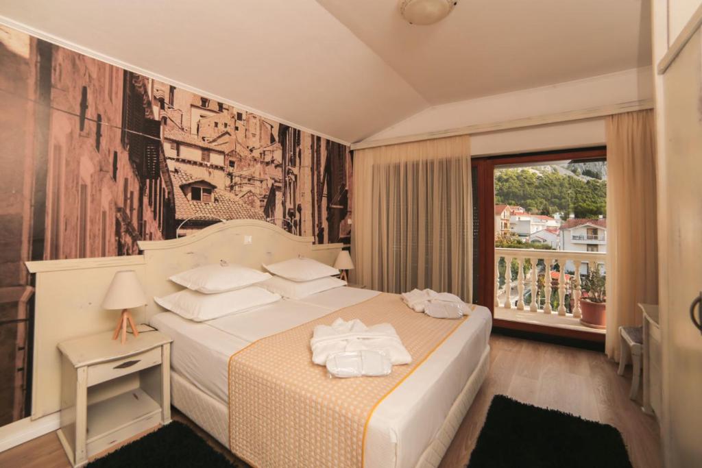马哥孛罗精品酒店客房内的一张或多张床位