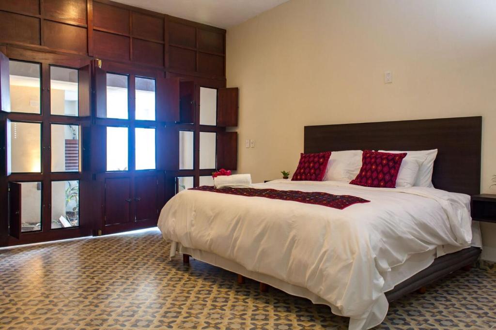 Hotel Maculís客房内的一张或多张床位