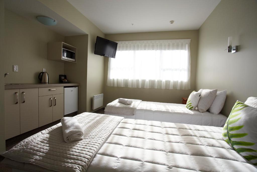Stumpers Hotel客房内的一张或多张床位