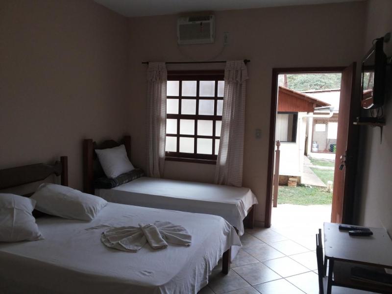 Pousada Clube Santa Cruz客房内的一张或多张床位