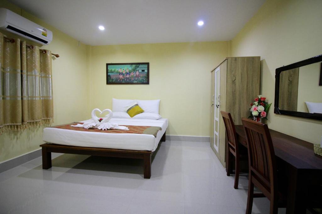 斯里暹罗度假酒店客房内的一张或多张床位