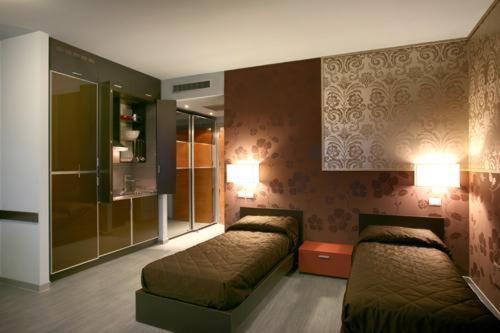 Residence San Marino客房内的一张或多张床位
