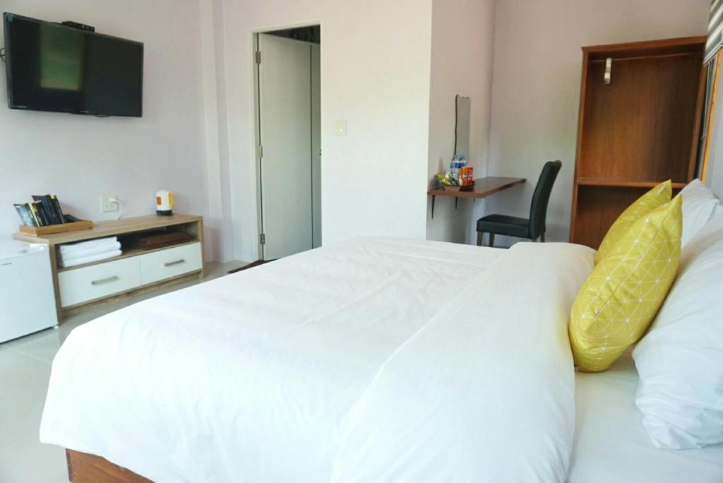 The Lodge at Koh Kood客房内的一张或多张床位