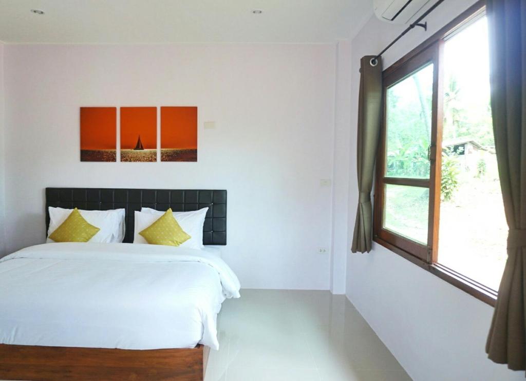 The Lodge at Koh Kood客房内的一张或多张床位