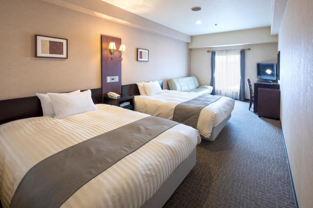 奈良皇家酒店客房内的一张或多张床位