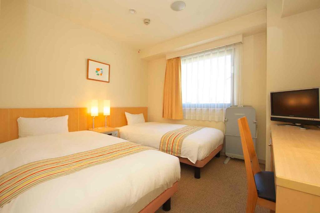 广岛芝山酒店客房内的一张或多张床位
