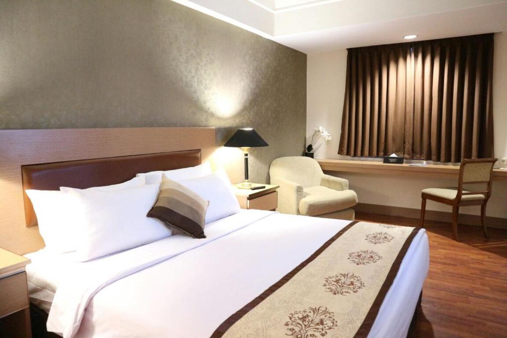 阿卡迪亚曼加杜亚酒店客房内的一张或多张床位