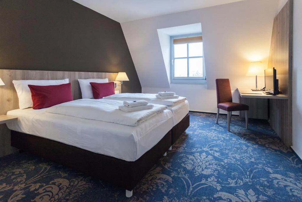 martas Hotel Lutherstadt Wittenberg客房内的一张或多张床位