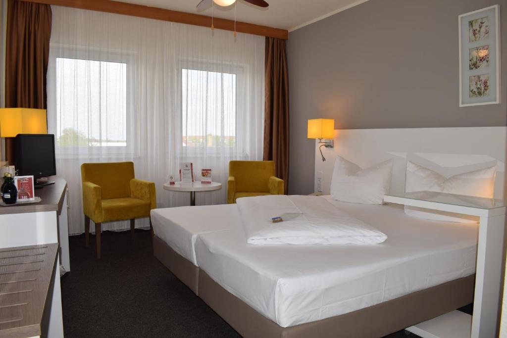 阿斯特拉尔茵莱比锡酒店与餐厅客房内的一张或多张床位