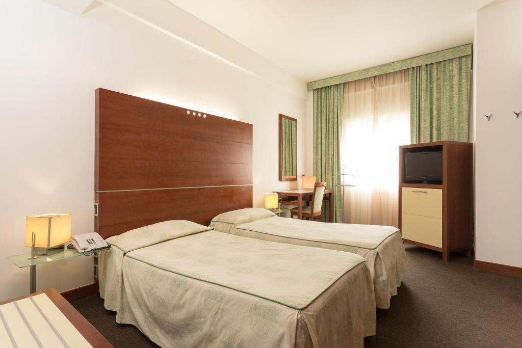 米尔伦酒店客房内的一张或多张床位