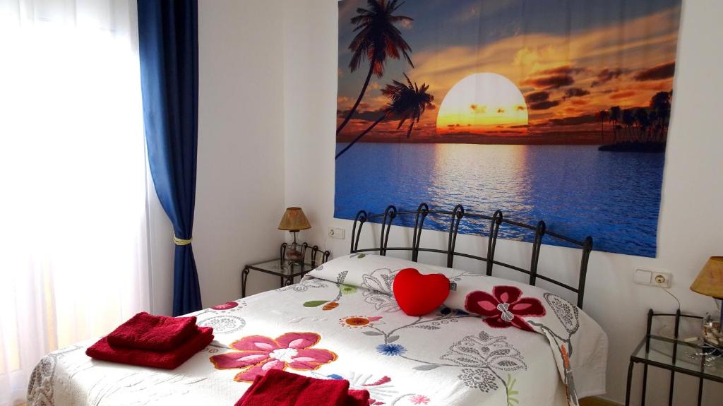 Fuertelena Sunrise Lovers Apartment客房内的一张或多张床位