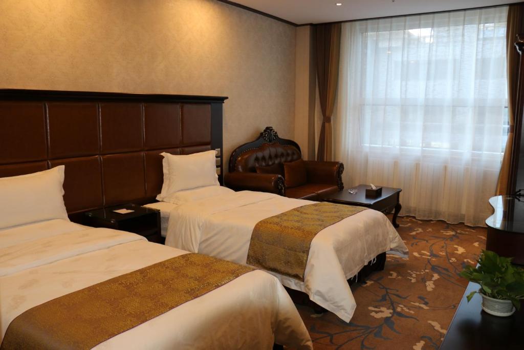 呼和浩特朗德国际酒店客房内的一张或多张床位