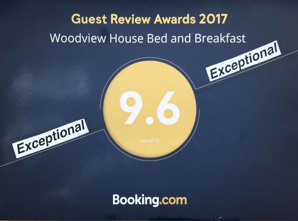 科克Woodview House Bed and Breakfast的住宿加早餐旅馆的客人收银员的标志