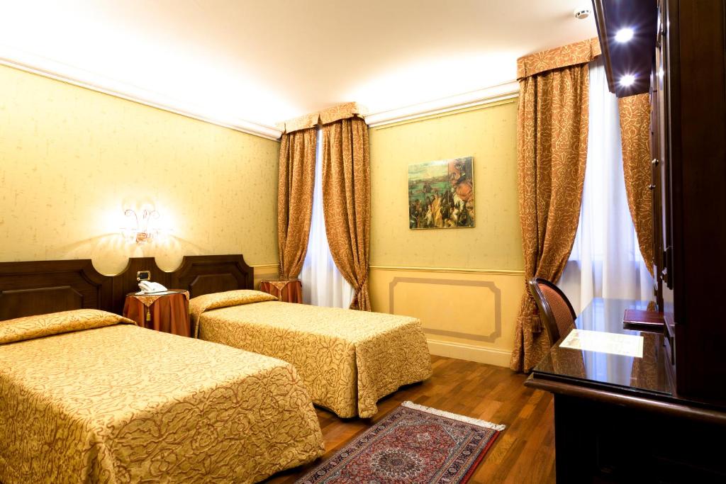 阿尔科德伽酒店客房内的一张或多张床位