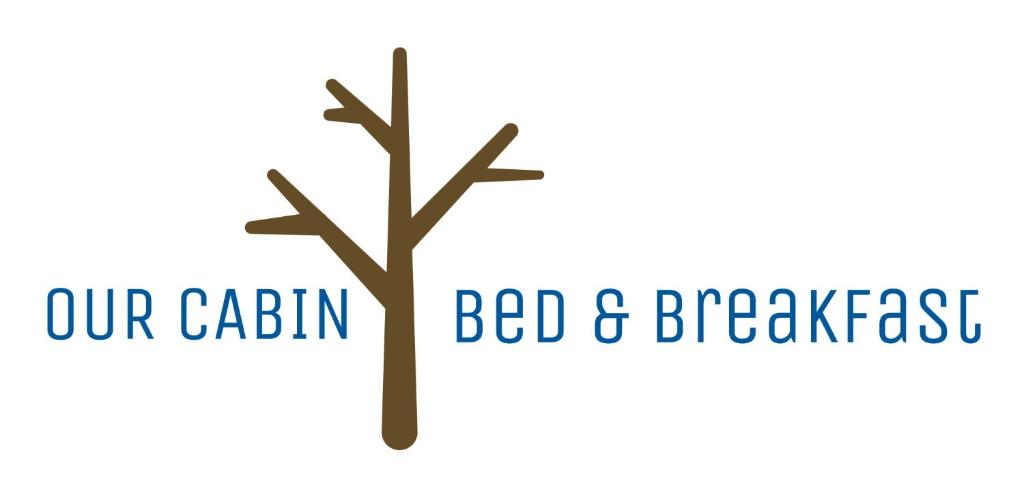 耶洛奈夫Our Cabin Bed & Breakfast的树上写着“住宿加早餐旅馆”和“小屋”