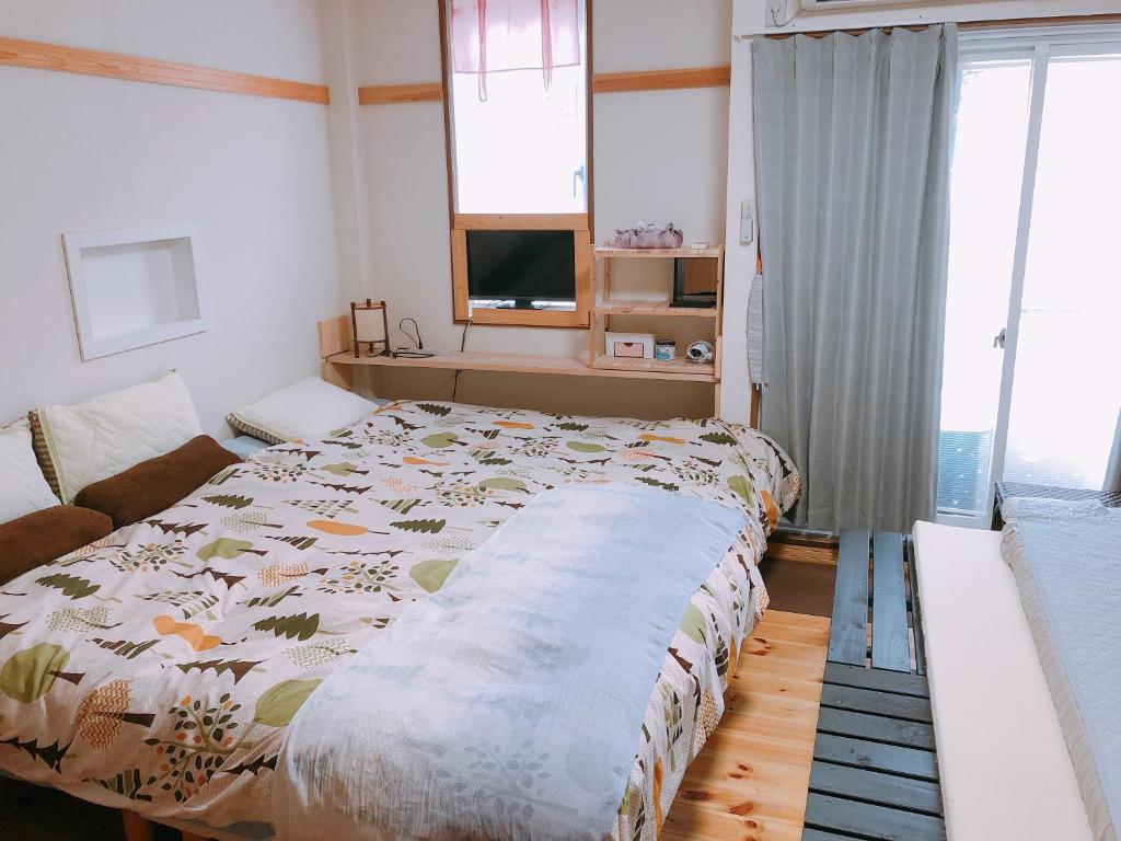 阪急感度假屋客房内的一张或多张床位