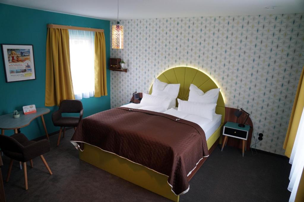 Themenhotel 50's Ville Motel客房内的一张或多张床位