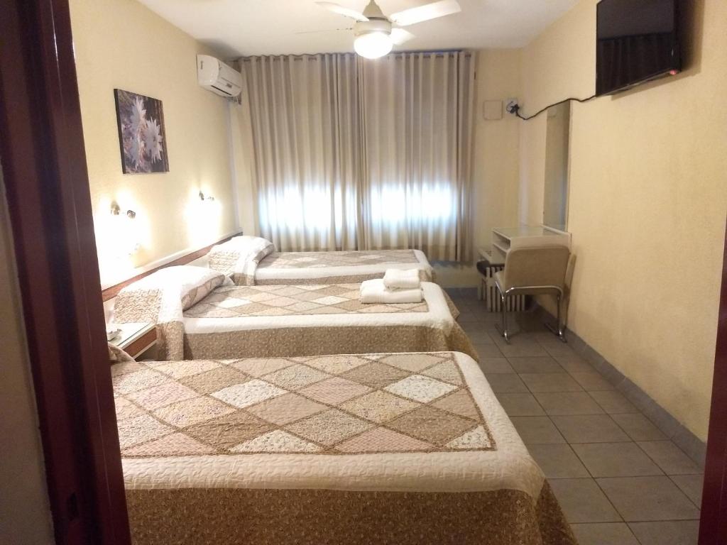 Hotel Suma Huasi客房内的一张或多张床位