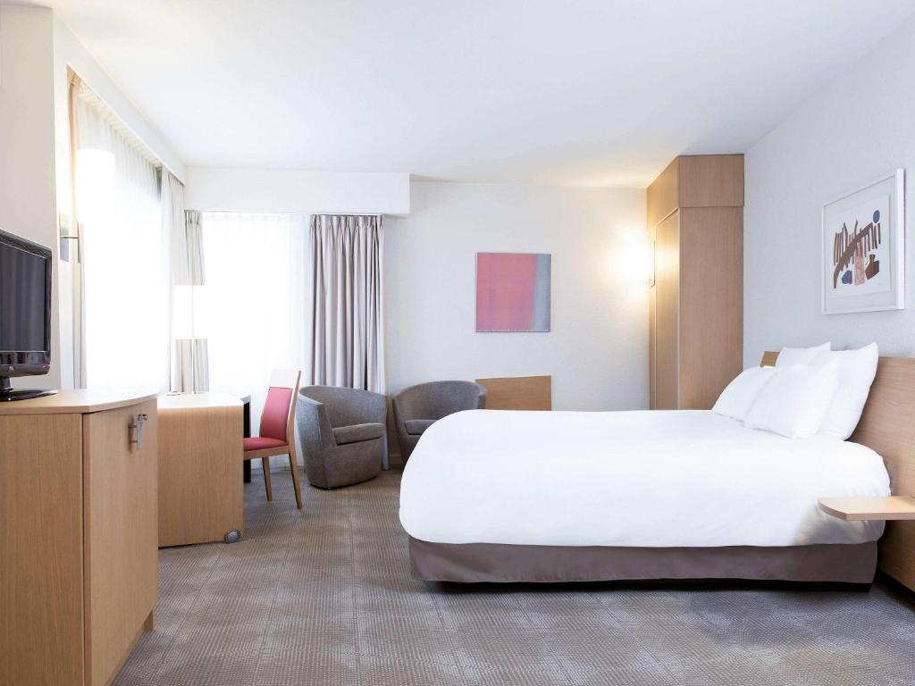 诺富特根特中心酒店客房内的一张或多张床位