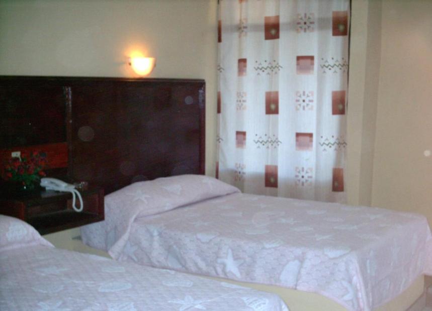 Hotel Duve Coral客房内的一张或多张床位