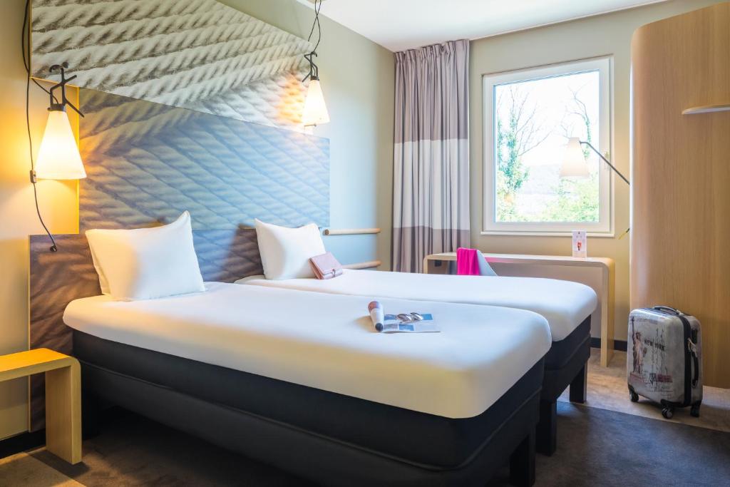 ibis Baden Neuenhof客房内的一张或多张床位