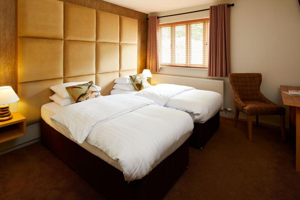 威瑞格林汽车旅馆，利比豪尔乡村的酒店客房设有两张床和窗户。