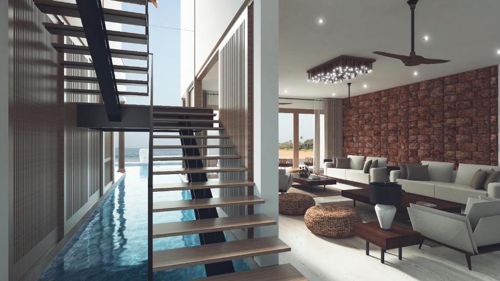 坦加拉Villa Blu的客厅设有通往游泳池的楼梯