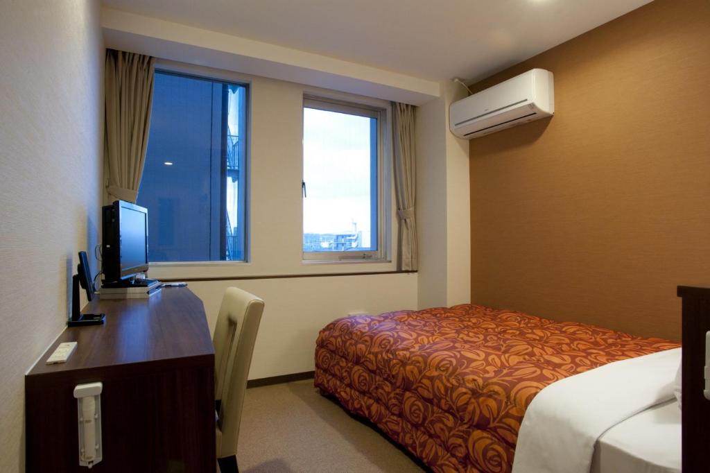 Hotel Kudou Oita客房内的一张或多张床位