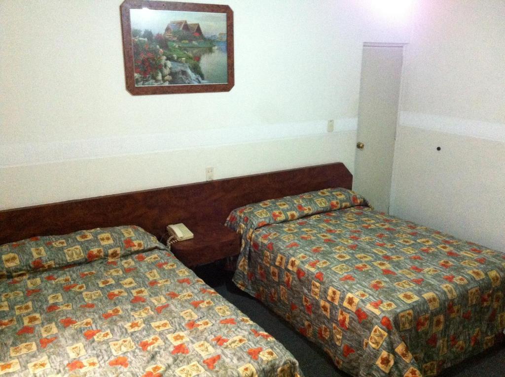 多斯纳西旺斯酒店客房内的一张或多张床位