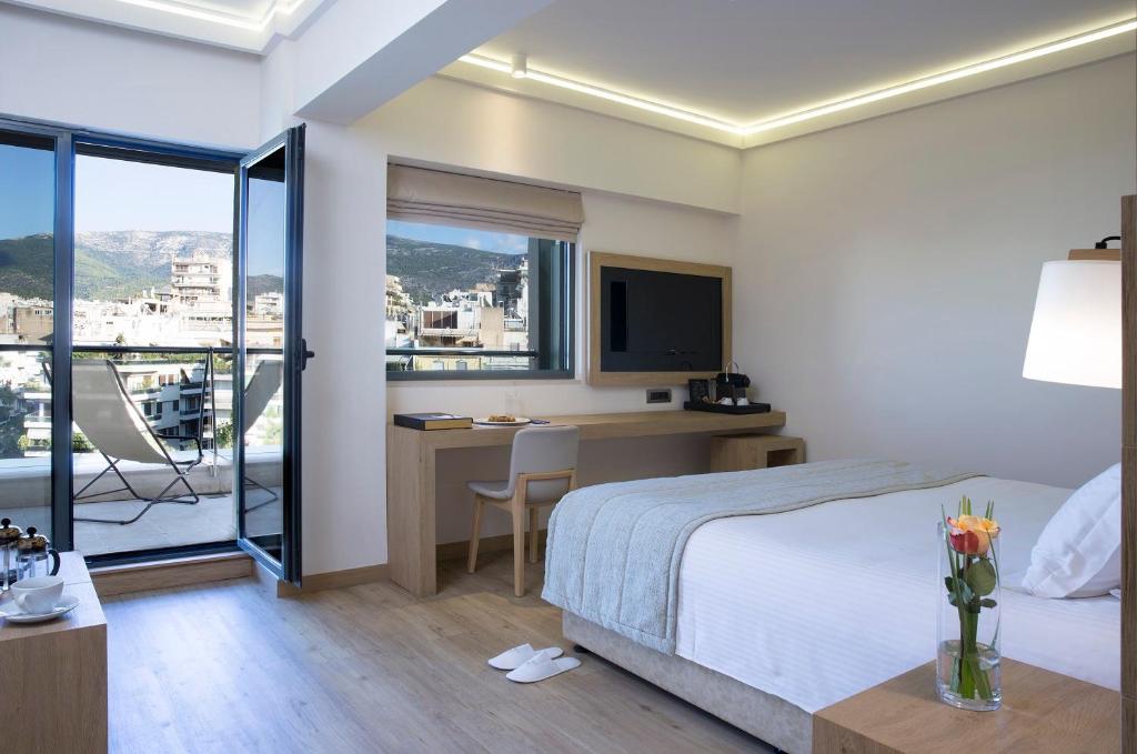 雅典黄金时代酒店客房内的一张或多张床位