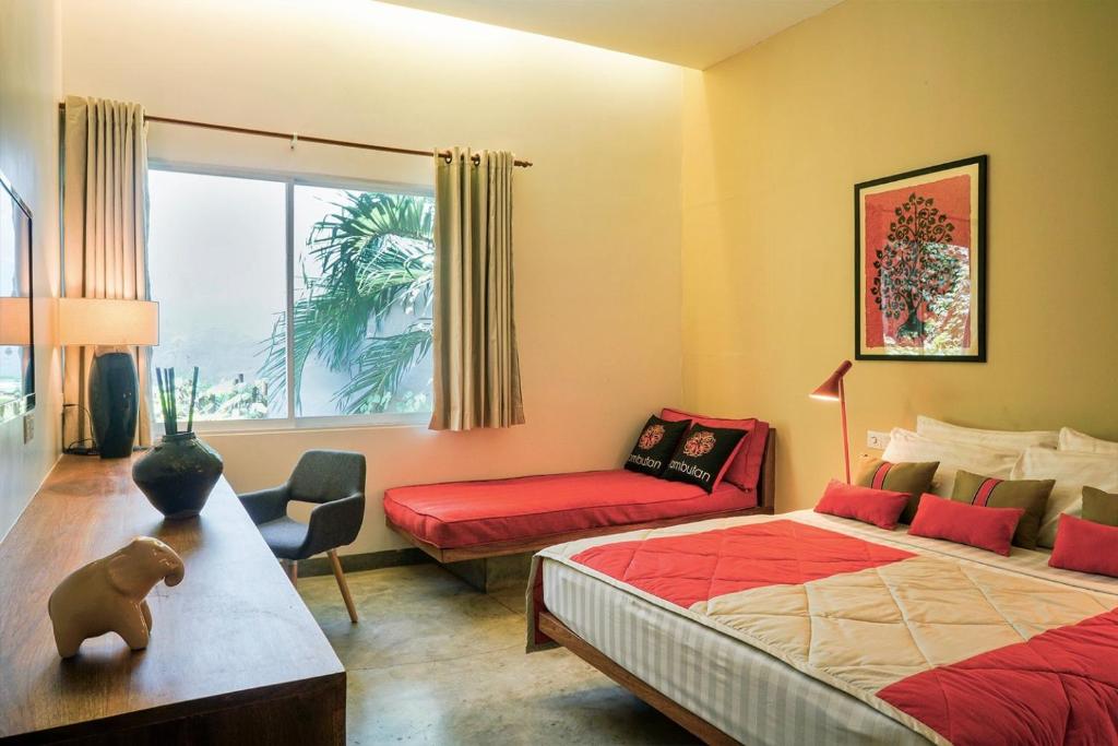 红毛丹酒店 - 金边客房内的一张或多张床位