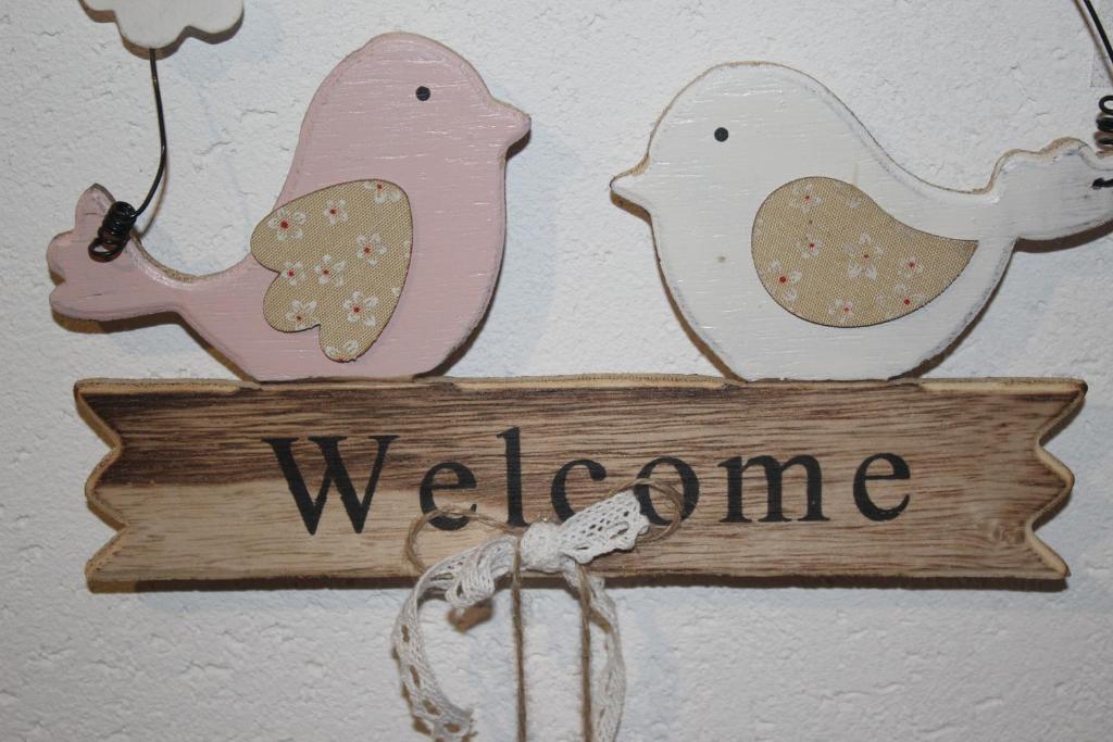 格林德尔瓦尔德格林德瓦博格露奥公寓的两只鸟的欢迎标志和欢迎标志