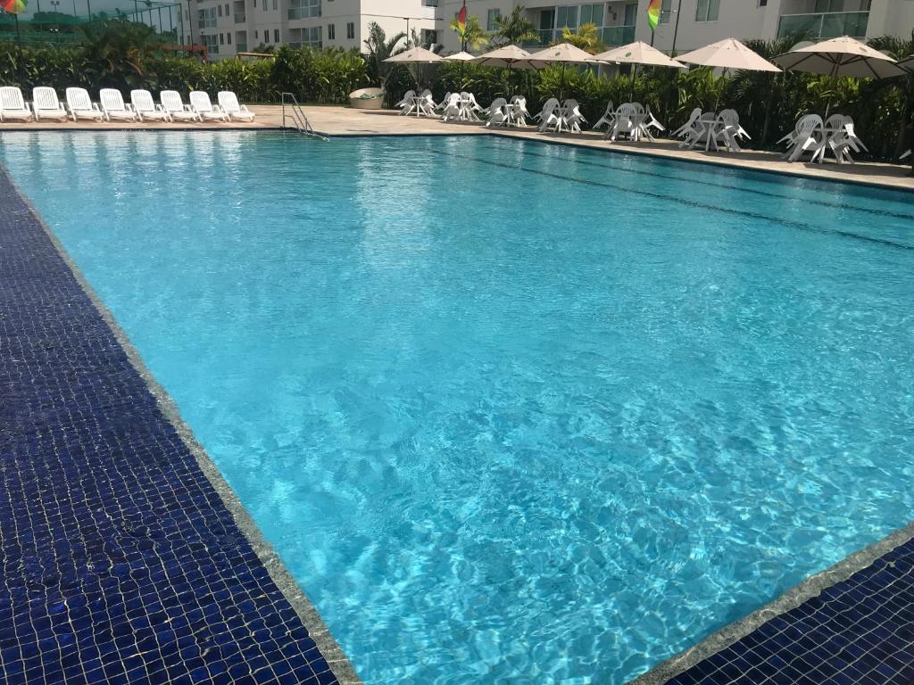 Flat Excelente em Porto de Galinhas PALM VILLAGE ACQUA frente para as piscinas内部或周边的泳池