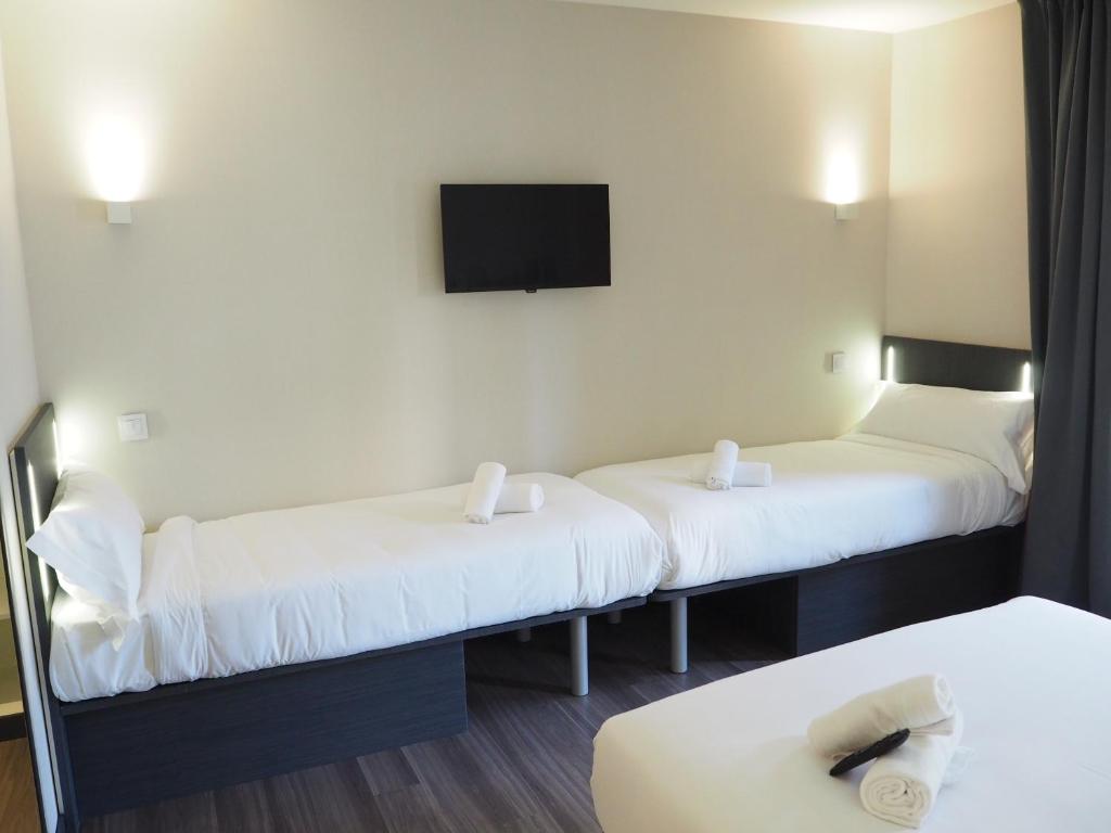 easyHotel Barcelona Fira客房内的一张或多张床位