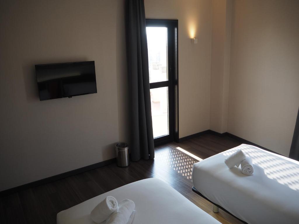 easyHotel Barcelona Fira客房内的一张或多张床位