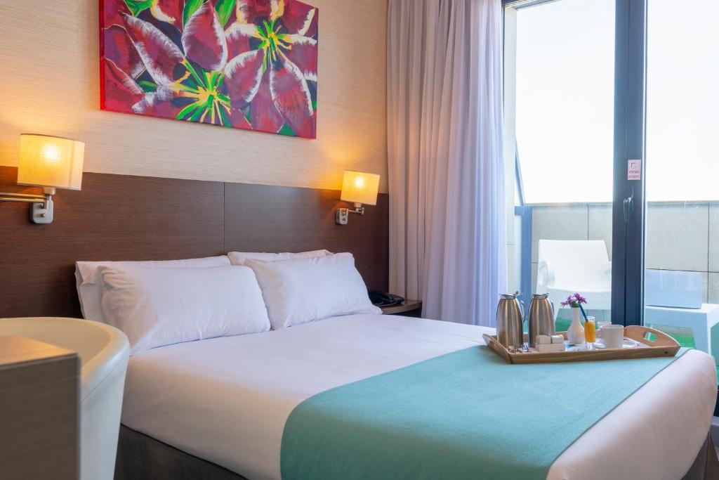 萨拉戈萨瑞市酒店及水疗中心客房内的一张或多张床位